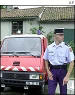 French policeman stands guard outside house of Ira Einhorn